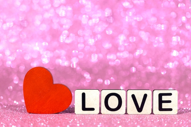 red heart with love message on blur background