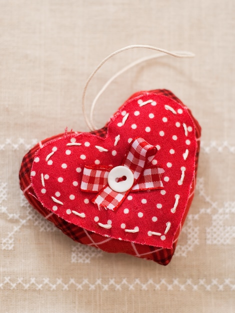 Red heart with ribbon bow on handmade