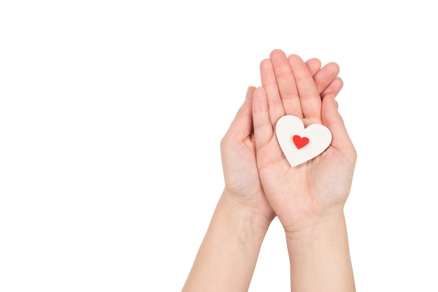 Red heart in woman hand isolated. Copy space.