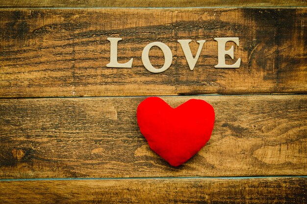 red heart on a wooden background