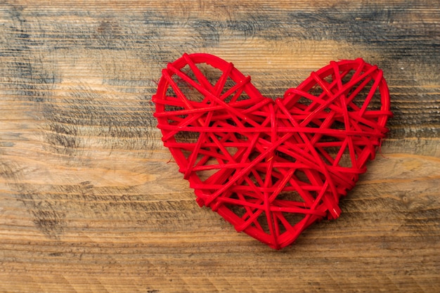 Red heart on a wooden board