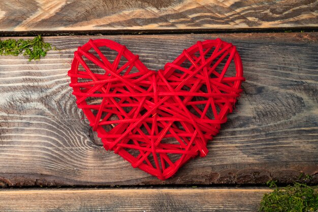 Red heart on a wooden board