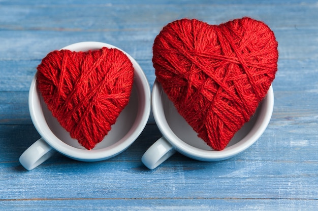 Red hearts on cups