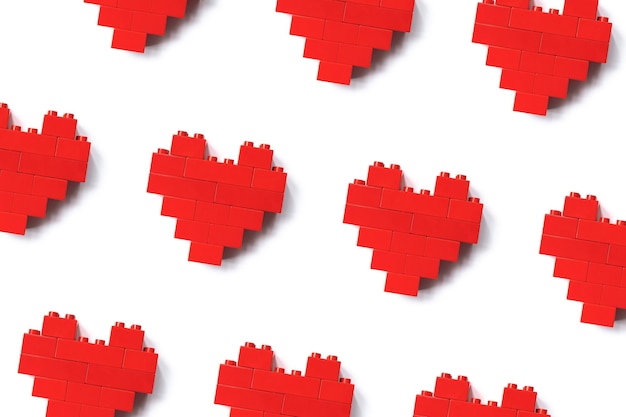 Red hearts from Legoblocks isolated on white background minimal geometric pattern from