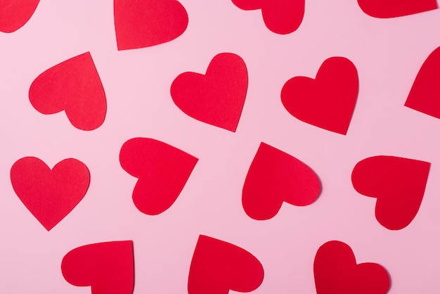 Red hearts on pink background Love and Valentines Day concept Valentines Day pattern