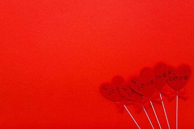 Red hearts on red background for valentines day holidays love and romance