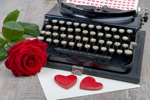 Red hearts and typewriter for Valentine's day