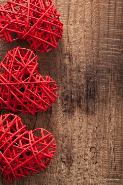 Red hearts over wooden background for Valentines day