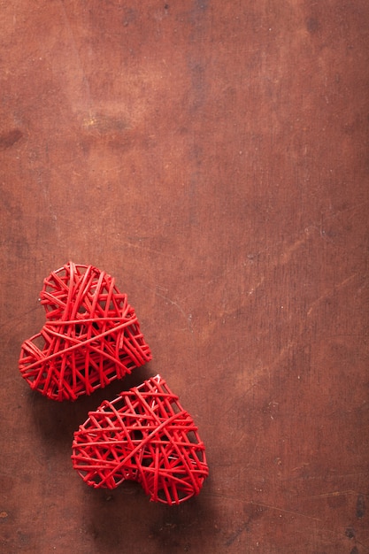 Red hearts over wooden background for Valentines