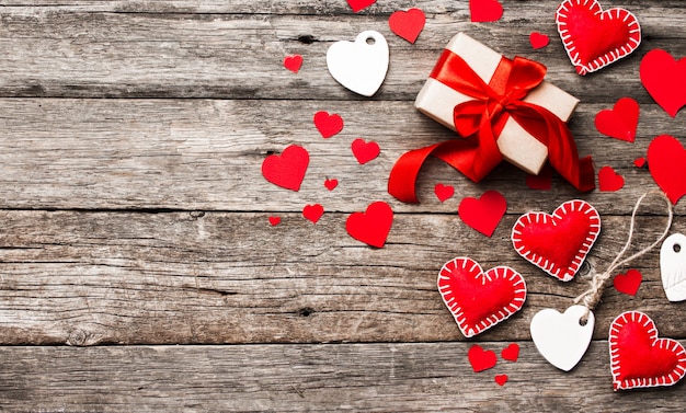 Red hearts on wooden table