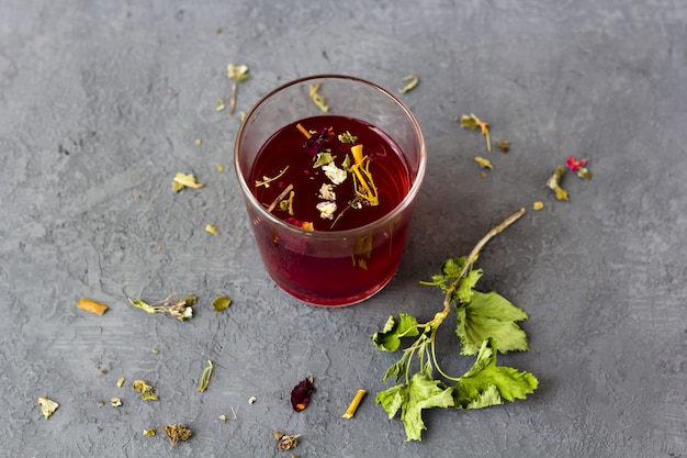 Red hibiscus tea in a glass cup