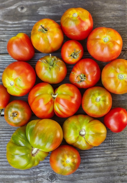 Red homemade tomatoes on the table. Top view