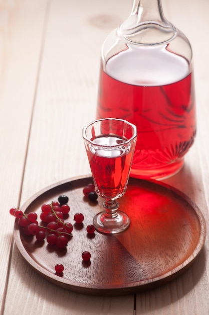 Red homemade wine from berries in a decanter