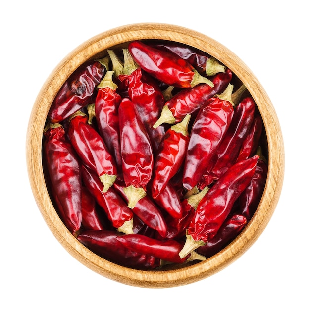 Red hot chili peppers in a bowl on white