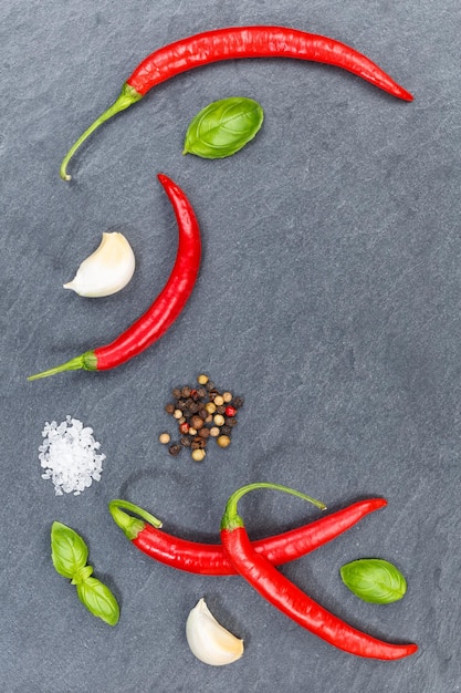 Red hot chili peppers chilli cooking ingredients portrait format slate background top view