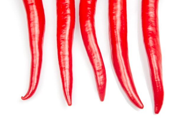 Red hot chili peppers on a white background food figures Vitamin vegetable food