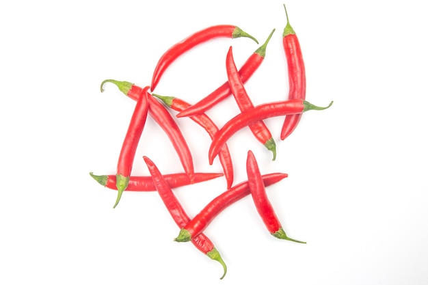 Red hot chili peppers on a white surface. food figures. Vitamin vegetable food