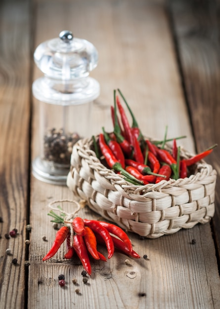 Red hot chili peppers on wooden table