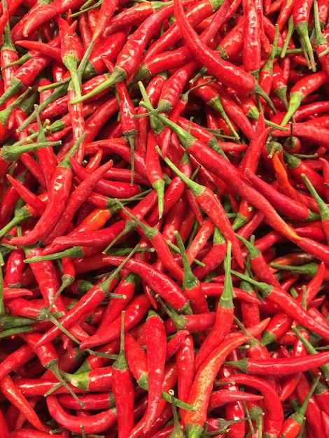 Red hot chilli peppers pattern texture background Close up