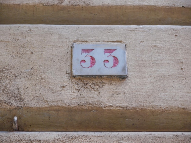 Red house number