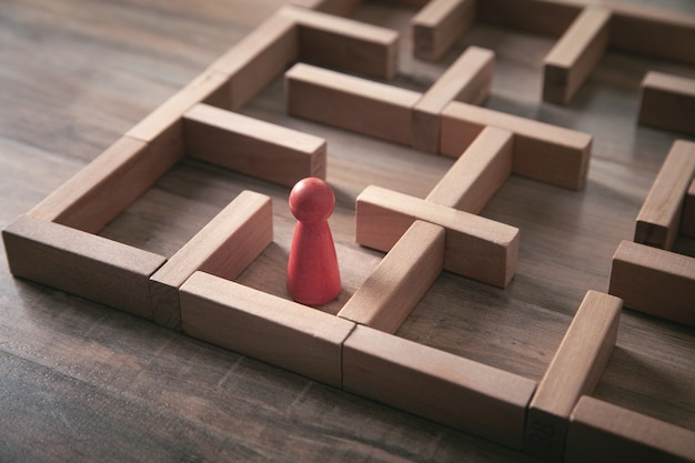 Red human figure standing in the labyrinth.