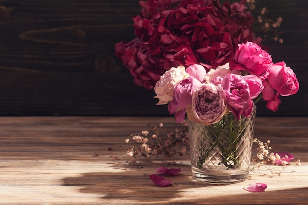 Red hydrangea flowers and pink roses