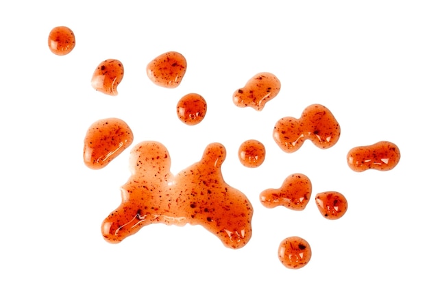 red jam splashes isolated on a white background top view