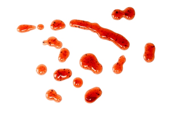 red jam splashes isolated on a white background top view