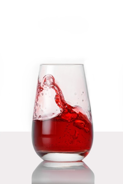 Red juice splashes on isolated white background