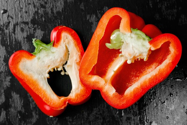 red juicy peppers on a dark background