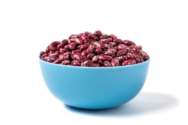 Red kidney beans in blue bowl isolated