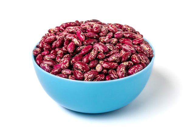 Red kidney beans in blue bowl isolated