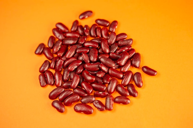 Red kidney beans on orange background