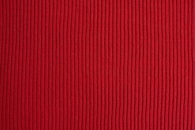 Red knitted fabric texture as background