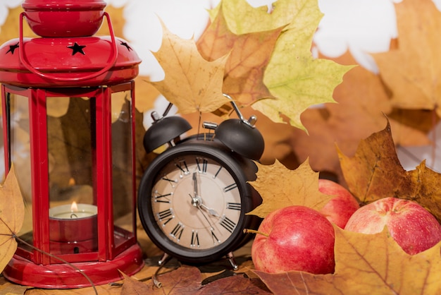 Red lantern lamp with candle and apples