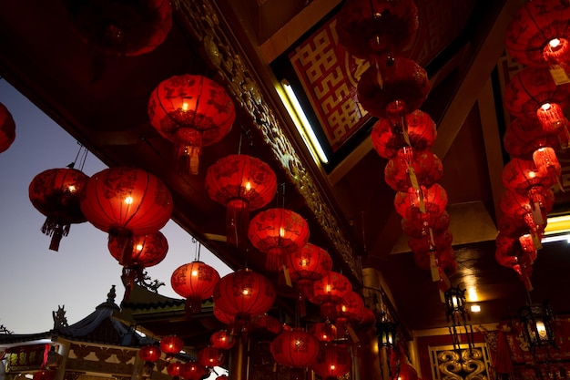Red lanterns hanging on chinese temple roof