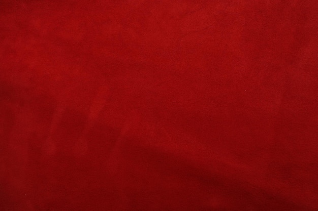 Red leather background with rough surface this photo close up form stool