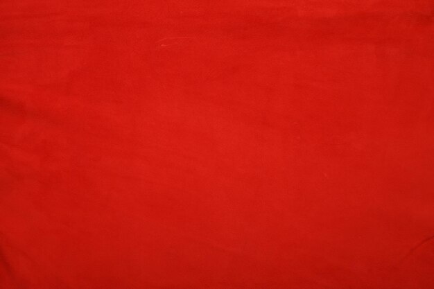 Red leather background with rough surface this photo close up form stool