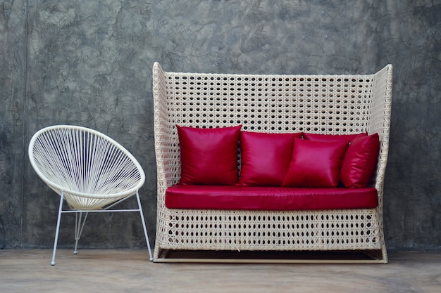 Red leather sofa with pillow