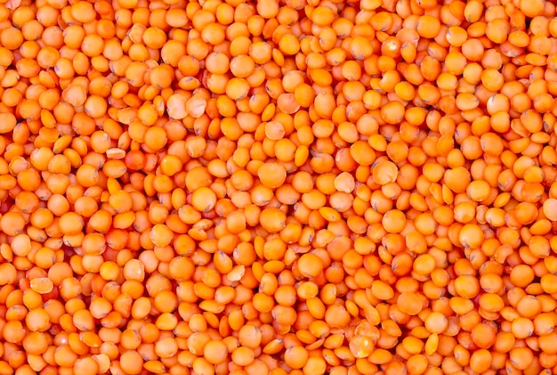 Photo red lentil on the white background