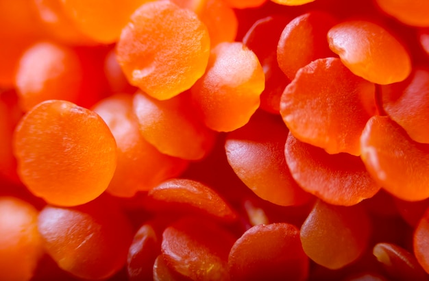 Red lentils background texture close up