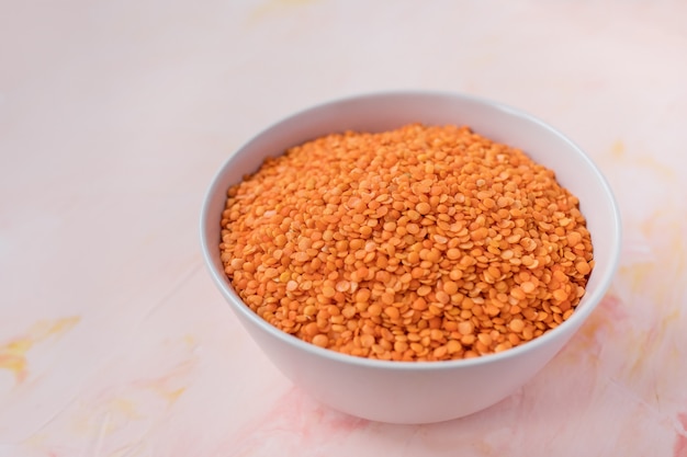 Red lentils in ceramic bowl