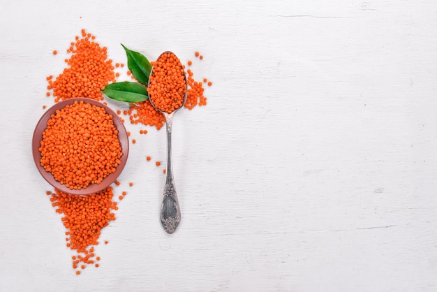 Red lentils On a wooden background Top view Copy space