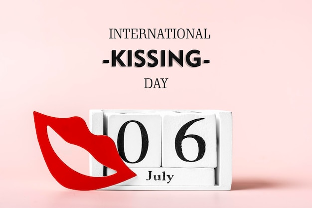 Red lips calendar isolated on pink background 06 July International Kissing Day concept