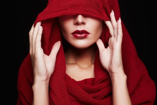 Red lips woman under hood