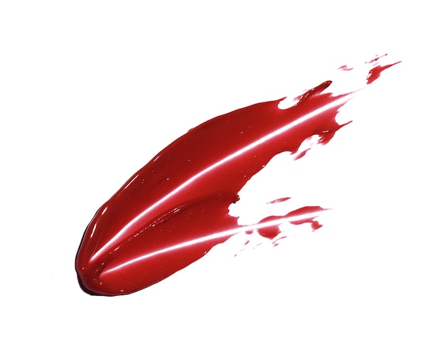 Photo red lipstick brush stroke isolated on white