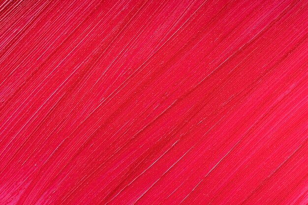 Красная помада мазок пятно образец текстуры фона косметический продукт лопаточный блеск крупным планом жидкая красота