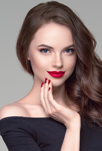 Red lipstick woman beauty curly hair close up face fashion portrait