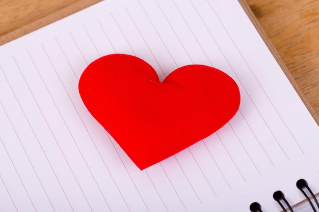 red love heart on line paper close up