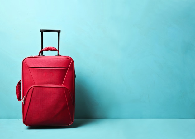 Red luggage with blue blackground